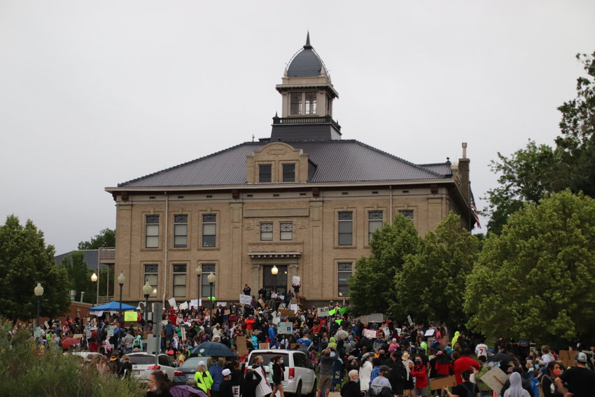 People gather on the lawn of the Littleton Municipal Courthouse as part of the Black Lives Matter Solidarity Walk on June 18. Hundreds of people attended, including much of the city council and school board.